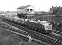 D1023 <I>Western Fusilier</I> roamed far and wide in the run-up to the final demise of the class in early 1977. On Saturday 29th January it ran from Paddington to Chester via the Severn Tunnel, Hereford and Crewe, returning via Wrexham to pick up the outward route at Shrewsbury. Here the 'Western Memorial' railtour is passing Chester No. 6 box just after departing from the city on the return to London.<br><br>[Bill Jamieson 29/01/1977]