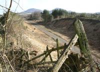 Looking south east along the trackbed of the Waverley route on 1 March 2013 towards the site of Tweedbank station, planned terminus of the Borders Railway. In the background the Eildon Hills stand just beyond the town of Melrose.<br><br>[John Furnevel 01/03/2013]