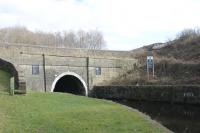 Gannow Junction is where the Colne branch diverges from the Copy Pit line. Immediately below the junction is the western portal of Gannow Tunnel (559 yards long) on the Leeds & Liverpool Canal. The tunnel doesn't take the canal under the railway, although it does cross the line near the eastern end at Burnley Barracks station. In this view a Sprinter heading for Colne can just be seen top right.<br><br>[Mark Bartlett 02/03/2013]