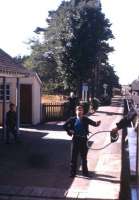 Token exchange at speed between ex-HR<I> Jones Goods</I> 4-6-0 no 103 and the signalman at Dalcross station in the summer of 1965.<br><br>[Frank Spaven Collection (Courtesy David Spaven) //1965]