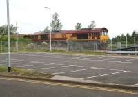 EWS 66008 stands at the west end of Uphall station with a ballast train on Sunday 29 June 2008 in connection with the redoubling of the line and construction of a second platform [see image 19979].<br><br>[John Furnevel 29/06/2008]