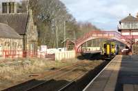 A Newcastle to Glasgow (via Dumfries) service draws in to the staggered platform at Haltwhistle. Although this is a Scotrail Sprinter working through (156501 from Corkerhill) the Carlisle to Newcastle leg of the journey is operated by and shown in the timetable as a Northern Service.<br><br>[Mark Bartlett 25/02/2013]