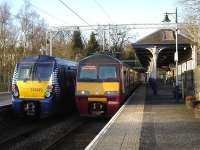 320312 prepares to leave Milngavie with the 16.12 for Motherwell on 18 February as 334023 waits at platform 2 with the 16.23 limited stop service to Edinburgh.<br><br>[David Pesterfield 18/02/2013]