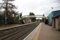 A quiet Sunday morning at Dalston, looking north towards Carlisle, with the original Maryport & Carlisle railway building visible on the opposite platform. <br><br>[Mark Bartlett 03/02/2013]