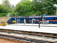 The down 'Highland Chieftain' stands at platform 19 at Waverley in the summer of 2006. GNER power car 43108 carries the name <I>Old Course St Andrews</I>. Passengers heading there will need to disembark at Leuchars and complete the last 5 miles by road, although the campaign to have the town reconnected to the ECML continues.  <br><br>[John Furnevel 12/08/2006]