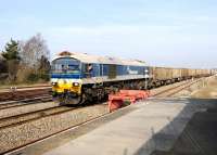 Hanson class 59 no 59101 <I>Village of Whatley</I> passing through Swindon station on 4 March with stone empties heading for Westbury via Melksham. The train had been held in one of the eastern loops for just over 30 minutes.<br><br>[Peter Todd 04/03/2013]