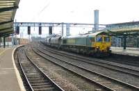 Freightliner 66511 wheels a long train of Ayrshire bound coal empties into Carlisle from the Shap line in February 2013. The train was held in the station for some time before eventually getting the road north.<br><br>[Mark Bartlett 25/02/2013]