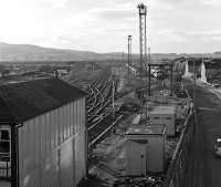 Looking west alongside Skipton Station North Junction box in November 1990 it can be seen that Skipton has experienced its fair share of railway rationalisation - the shed yard once stood over on the left. The sidings to the north of the main line are still in use for stabling and maintaining stock involved with the Tilcon stone traffic from Rylstone, with Brush Type 2s Nos. 31180 and 31327 stabled on the far right road.<br><br>[Bill Jamieson 17/11/1990]