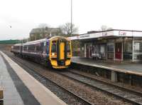 The ever versatile Class 158s tend to be associated with longer distance, semi-express services but on 8th March 2013 Haymarket's 158734 was rostered to the Motherwell - Cumbernauld shuttle and is seen here arriving at the latter station. A single DMU is able to provide an hourly service in each direction on this diagram. [See image 21344] for the same view nearly 50 years earlier. <br><br>[Mark Bartlett 08/03/2013]