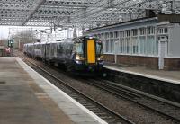 New trains and a new roof - things are looking brighter at Paisley Gilmour Street even on a dull day in March 2013. With the December 2012 timetable changes some trains now run through the station non-stop, including this one coming from the Ayr line formed by 380116.<br><br>[Mark Bartlett 08/03/2013]