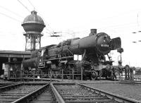 DB class 50 2-10-0 No. 053 075 was another late built example of the class constructed to a simplified design, in this case retaining its original 'bath-tub' tender. Here it is retiring into the roundhouse at Duisburg-Wedau shed after a Saturday morning's toil around the Ruhr, which was still had a number of steam depots in 1975. The situation was similar to the last months of steam on BR in Lancashire during 1968 except that the locos were a lot cleaner!<br><br>[Bill Jamieson 30/08/1975]