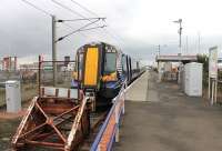 When the sleek, four car, Class 380s run down to Ardrossan Harbour but don't actually connect with a ferry they look a bit incongruous in the station. 380108 has a half hour layover in the near deserted branch terminus before returning to Glasgow Central. <br><br>[Mark Bartlett 08/03/2013]