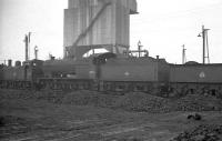 Fowler 7F 0-8-0 no 49592 stands alongside the coaling plant on Bolton shed in the late 1950s. The locomotive was finally withdrawn from Newton Heath in May 1959.<br><br>[K A Gray //]