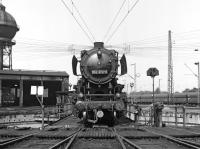 As can be seen from the shed clock, it's into the afternoon on Saturday 30th August 1975 so class 50 2-10-0 No. 052 372 will have completed its diagrammed workings around the Ruhr and is retiring into Duisburg-Wedau shed for the remainder of the weekend. The roundhouse was able to stable electric as well as steam (and diesel) locos which will seem very strange to British eyes.<br><br>[Bill Jamieson 30/08/1975]