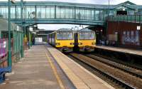 Scene at Sheffield's Meadowhall interchange on 12 March 2013 with class 144s at platform 1 heading to Lincoln and platform 2 heading to York. These platforms are on the lines towards York and Doncaster. Out of sight to the left platforms 3 and 4 serve the lines to Barnsley. Finally, to complete the 'interchange,' to the right of platform 1 are two further platforms on the terminus of the Sheffield <I>Supertram</I>.<br><br>[John McIntyre 12/03/2013]