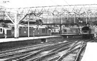 Lunchtime at Liverpool Street in 1982. On the left is 37109 preparing to leave with a train for Kings Lynn. In the centre background is 37084 with empty stock. On the right 47115 is approaching with a semi-fast from Norwich.<br><br>[John Furnevel 18/02/1982]