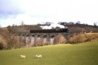 An unidentified Ivatt 4MT 2-6-0 with the branch train from Langholm crossing Tarras Viaduct on 12th April 1964. The train is on its way back to Carlisle.<br><br>[Frank Spaven Collection (Courtesy David Spaven) 12/04/1964]