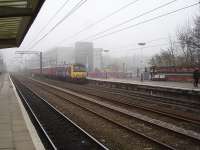 Northern Rail EMU 321903 runs into Wakefield Westgate from Leeds to form the 09.37 service onwards to Doncaster, passing work just starting on construction of the new up side station main building and new north end DDR footbridge. <br><br>[David Pesterfield 05/03/2013]