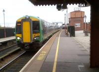 The 10.29 to Kidderminster [see image 40435] comprises a shiny new 172 at Birmingham Moor Street on 9th November 2012. Notice the GW-liveried water tank, and the poster of the Shakespeare Express on its end. The bike leaning on the lamppost is a timeless detail.<br><br>[Ken Strachan 09/11/2012]