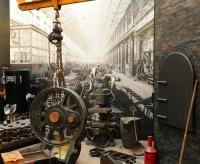 Past and present seem to merge through some clever use of old photographs as a backdrop to exhibits at Swindon Steam Museum in March 2013.<br><br>[Peter Todd 20/03/2013]