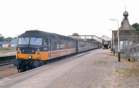 In 1990 the new Sprinters were withdrawn not long after introduction on the Inverness to Aberdeen route. ScotRail managed to rustle up some locomotive hauled sets at short notice. 47642 stands at Inverurie with an Inverness bound service. <br><br>[Ewan Crawford //1990]