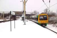 A large helping of the deep and crisp and even, please. It may look like Christmas, but this is the weekend before Easter as a class 323 forms the 14.07 to Redditch. Notice the disused island platform on the left; the station building at road level; and the distinct absence of footprints in the snow.<br><br>[Ken Strachan 24/03/2013]