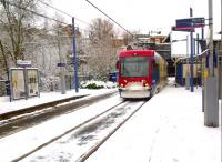 The light rail side of the station at Birmingham's Jewellery Quarter [see image 42485] with the 13.26 Midland Metro tram to Wolverhampton St. Georges arriving.  (there was a 15-minute interval service, being a Sunday)<br><br>[Ken Strachan 24/03/2013]