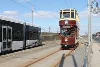 Easter 2013 saw the return of heritage trams to the Blackpool system and, for the first time since the system refurbishment, some heritage trams ran through to Fleetwood. Most reversed at Bispham however, including Bolton No.66 seen here crossing over to head south for Pleasure Beach passing a northbound Flexity.<br><br>[Mark Bartlett 29/03/2013]