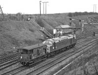 When first introduced to service in April 1960 from Gateshead shed, EE Type 4 No. D270 would have been no stranger to class 1 work on the ECML, but by 1977 (as 40070) it was reduced to pottering about the West Riding on colliery trip workings from Healey Mills. Here it is on a Saturday morning in February of that year heading home to HM past Goose Hill Junction with just an ex-LMS brake-van in tow. <br><br>[Bill Jamieson 12/02/1977]