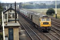 Knottingley resident No. 1892 leaves the east end of Wath Yard with a rake of HAA coal hoppers in July 1971.The wagons appear to be empty so they have probably come over the Pennines from Fiddlers Ferry Power Station and are now being tripped to a Yorkshire colliery for reloading.<br><br>[Bill Jamieson 21/07/1971]