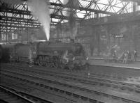 45718 <I>Dreadnought</I> stands in the gloom at Carlisle station on a winter's day in February 1961. The Kingmoor Jubilee has just taken over the 10.5am Edinburgh Waverley - London St Pancras, which it is about to take out on the next leg of its journey as far as Leeds City.<br><br>[K A Gray 10/02/1961]