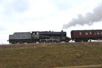 Stanier 8F no 8274 with a train near Winchcombe on 29 March 2013.<br><br>[Peter Todd 29/03/2013]