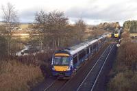 A northbound Glasgow Queen Street to Aberdeen service is about to pass the southbound <I>Highland Chieftan</I> at Ashfield (north of Dunblane) on Sunday 18th November 2012.<br><br>[Mark Dufton 18/11/2012]