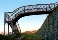 The footbridge at Buckpool in 1997, looking east along the former Moray Coast line towards Buckie.<br><br>[Ewan Crawford //1997]