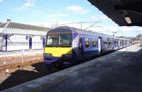 A service for Milngavie awaiting its departure time at Lanark on 3 April 2013. <br><br>[John Steven 03/04/2013]