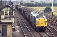 6733 leaves Wath Yard heading east with a partially fitted train of assorted loaded coal wagons. When this photograph was taken in 1971 the yard had less than 20 years of operational life remaining, with complete closure coming in 1988 along with the demise of the last of the local collieries.<br><br>[Bill Jamieson 21/07/1971]