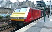 DVT 82132 on the rear of a North Berwick - Haymarket push-pull service at Waverley platform 10 in July 2004 (with 90033 at the front end). These services operated between May 2004 and September 2005 when the on-loan class 322 emus returned south. The stand-in services consisted of spare ex-Virgin Mk 3 push-pull stock and EWS class 90s. As with 82132, the stock remained in basic Virgin livery with the addition of ScotRail logos. <br><br>[John Furnevel 19/07/2004]