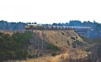 Freightliner 66618 crosses Carrbridge Viaduct on 4 April heading for Inverness with a cement train from Oxwellmains. <br><br>[John Gray 04/04/2013]