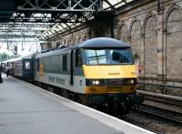 EWS 90033, still in Railfreight Distribution livery, on the front of a North Berwick - Haymarket push-pull service at Waverley platform 10 in July 2004 [See image 42641].<br><br>[John Furnevel 19/07/2004]