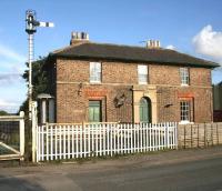 View east over the level crossing at Weaverthorpe on the York - Scarborough line in October 2008. The station here closed to passengers in 1930. [See image 21215]<br><br>[John Furnevel 02/10/2008]