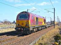 67007 passes St Germains level crossing with the 6B44 empty 'Binliner' from Oxwellmains to Powderhall on 6 April 2013.<br><br>[Bill Roberton 06/04/2013]