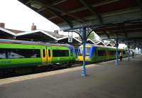 Central Trains DMUs passing at March station in July 2006.<br><br>[Ian Dinmore /07/2006]