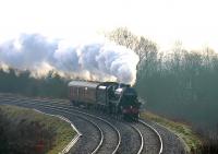 Coasting down hill in the morning mist is Black 5 44932, which is about to work <I>The Lancastrian</I> charter around the Preston-Carnforth-Hellifield-Blackburn-Preston loop. The engine and its support coach had worked down from Carnforth and have just turned on the Farington triangle ready for the northbound departure from Preston. [See image 42082]<br><br>[Mark Bartlett 16/02/2013]