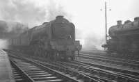 The unique A3 Pacific 60097 <I>Humorist</I> adds to the fog hanging over Victoria Viaduct as it leaves Carlisle on 22 December 1962 with the 1.40pm to Edinburgh. Standing on the right is local favourite <I>Jezebel</I> [see image 30631].<br><br>[K A Gray 22/12/1962]