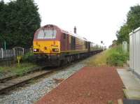 A loco hauled passenger train is an unusual sight on the Preston to Ormskirk line but, on 17 August 2008, 67028 and 67030 top and tailed the <I>Northern Belle</I> set with a charter in connection with the Open Golf championships at Royal Birkdale. The train is passing the former Midge Hall station as it slows to collect the single line token for the section to Rufford.<br><br>[John McIntyre 17/08/2008]