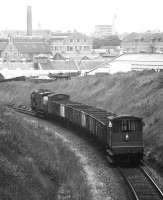 A Class 08 shunter heads a short freight south from Kittybrewster in May 1985 bound for Guild Street yard.<br><br>[John McIntyre /05/1985]