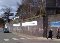 The embankment for the Northampton lines at Market Harborough [see image 42700] was quite wide. Still, there's plenty of advertising space for the railway.<br><br>[Ken Strachan 05/04/2013]