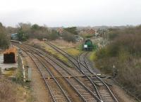 The oil terminal at Dalston still sees regular trains from Grangemouth and on this quiet Sunday morning in February 2013 the unloading siding was full. From the road bridge just south of the terminal the station platforms can be seen, as can a large stock of 60' rails that have presumably been recovered following a recent relaying operation. <br><br>[Mark Bartlett 03/02/2013]