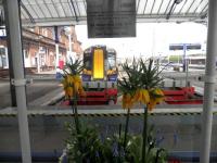 Looking over the buffer stops at Ayr on 18 April 2013 with a train for Glasgow Central awaiting its departure time at platform 1.<br><br>[John Yellowlees 18/04/2013]