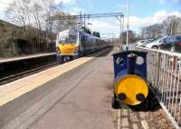 For the local Westerton Centenary celebrations, Westerton School has adopted this barrel-train. A city bound service arrives alongside on 19 April 2013. <br><br>[John Yellowlees 19/04/2013]